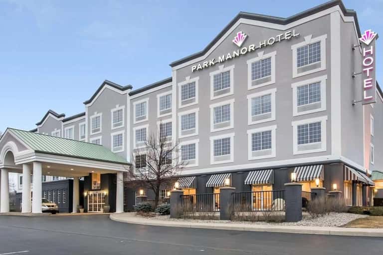 Park Manor Hotel exterior with multiple floors, entrance canopy, and contemporary signage