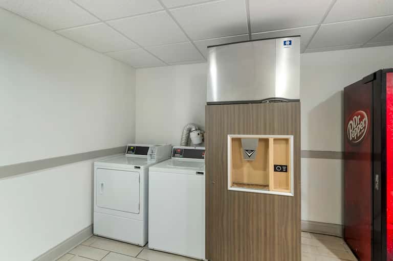 Hotel laundry facility with washers, dryers, ice machine, and vending machine