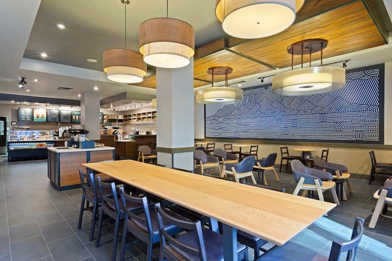 Modern hotel restaurant and café with contemporary lighting and open seating area
