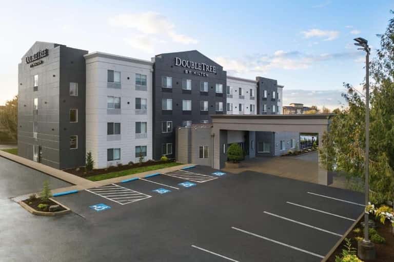 Double Tree by Hilton hotel exterior with modern architecture and accessible parking spaces
