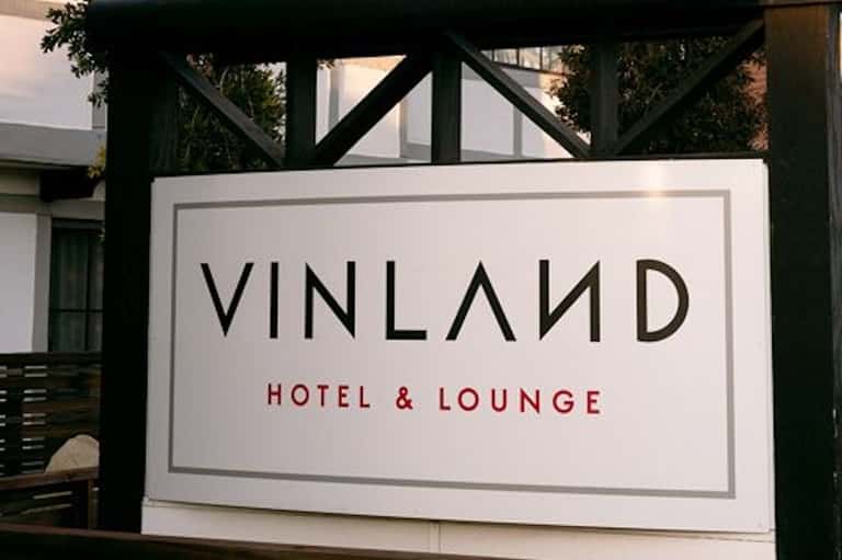 Vinland Hotel & Lounge exterior signage with black and white architecture