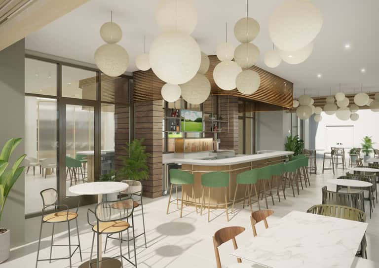Contemporary hotel lounge with spherical pendant lights, wooden kitchen island, green bar seating, and dining tables