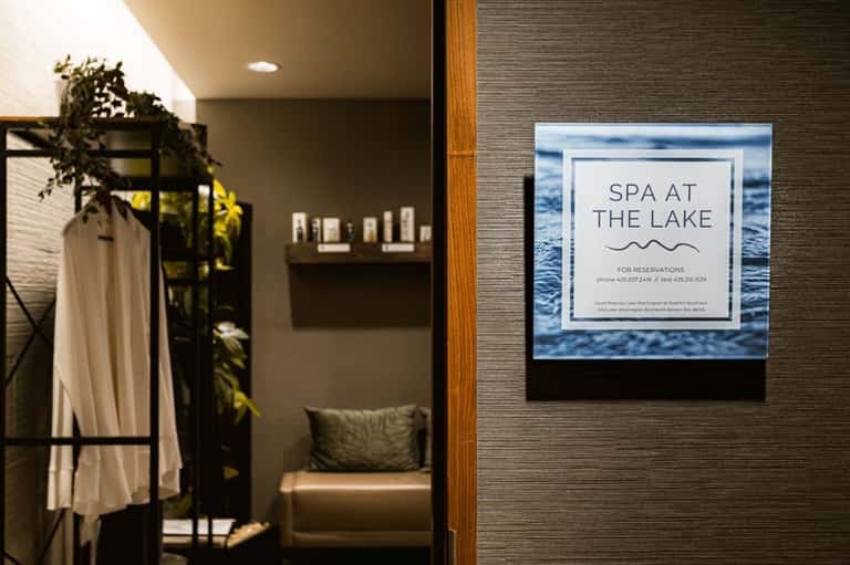 Spa entrance sign reading 'Spa at the Lake' with interior view of consultation area