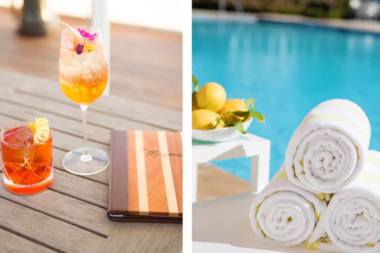 Poolside cocktails and rolled white towels with fresh lemons by resort pool