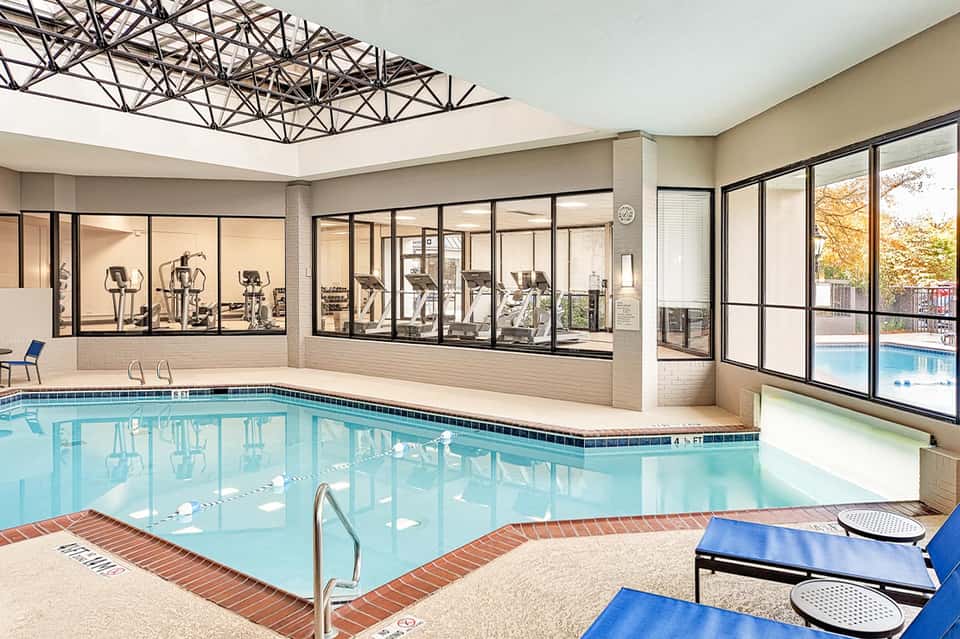Indoor heated swimming pool with fitness center and large skylight