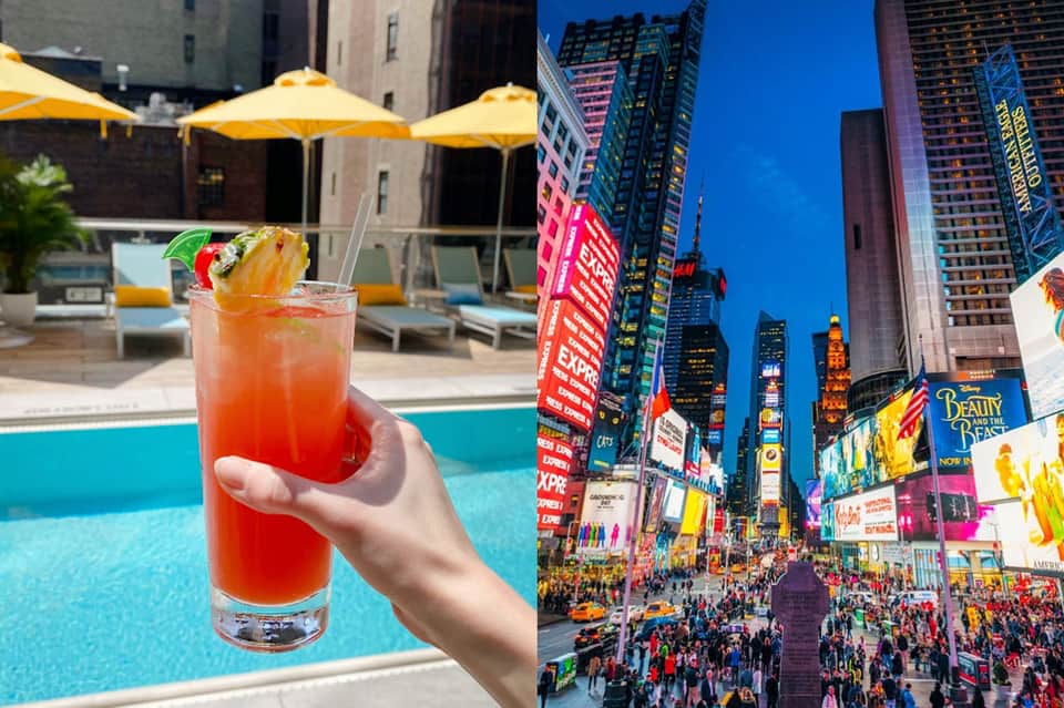 Tropical cocktail by pool with yellow umbrellas and Times Square cityscape at dusk