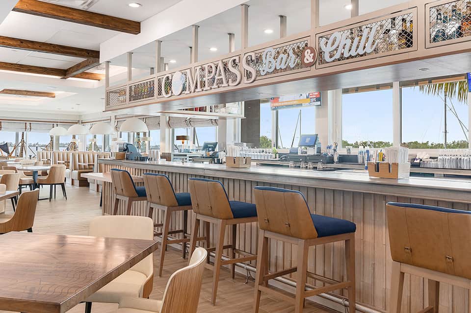 Upscale waterfront restaurant with wooden finishes and marina views