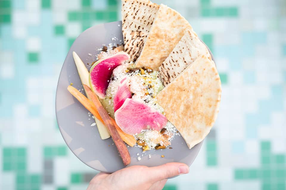 Gourmet dragon fruit dessert plate with matzo crackers and tropical fruit garnish
