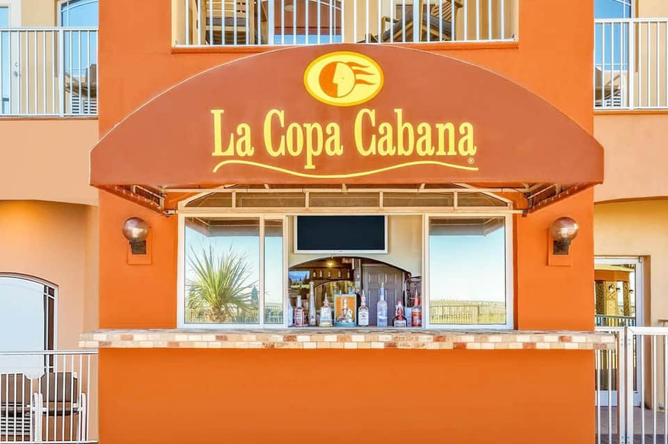 Orange storefront with La Copa Cabana signage and tropical ambiance at beachfront resort