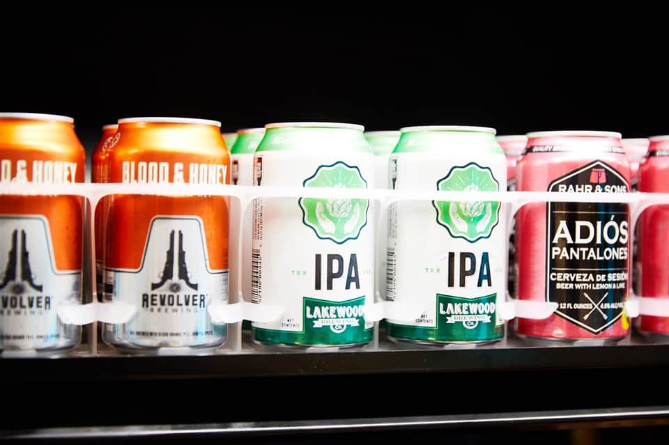 Selection of craft beers on shelf including Blood & Honey, Revolver, Lakewood IPA, and Adiós Pantalones