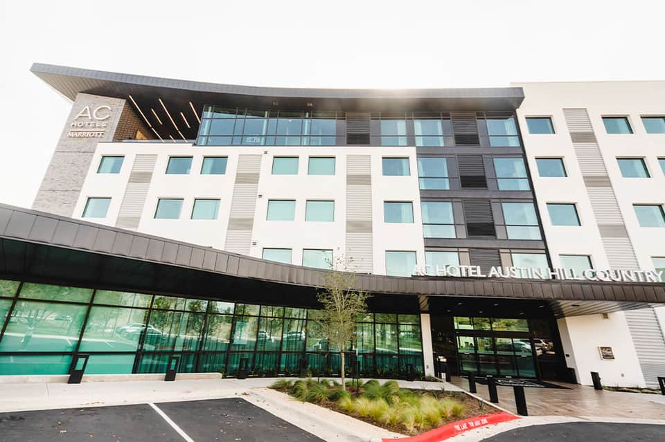 Modern AC Hotel building exterior with contemporary glass and white facade design
