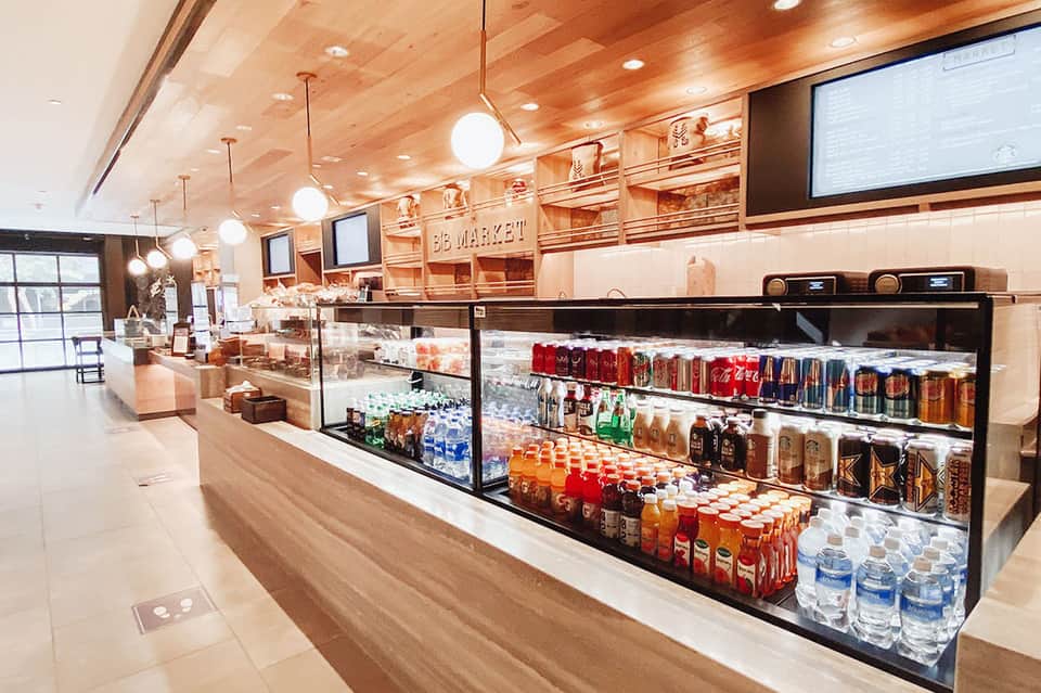 Contemporary market interior with beverage coolers and wooden ceiling details