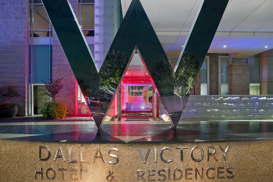 Dallas Victory Hotel & Residences modern entrance with illuminated geometric architecture at night