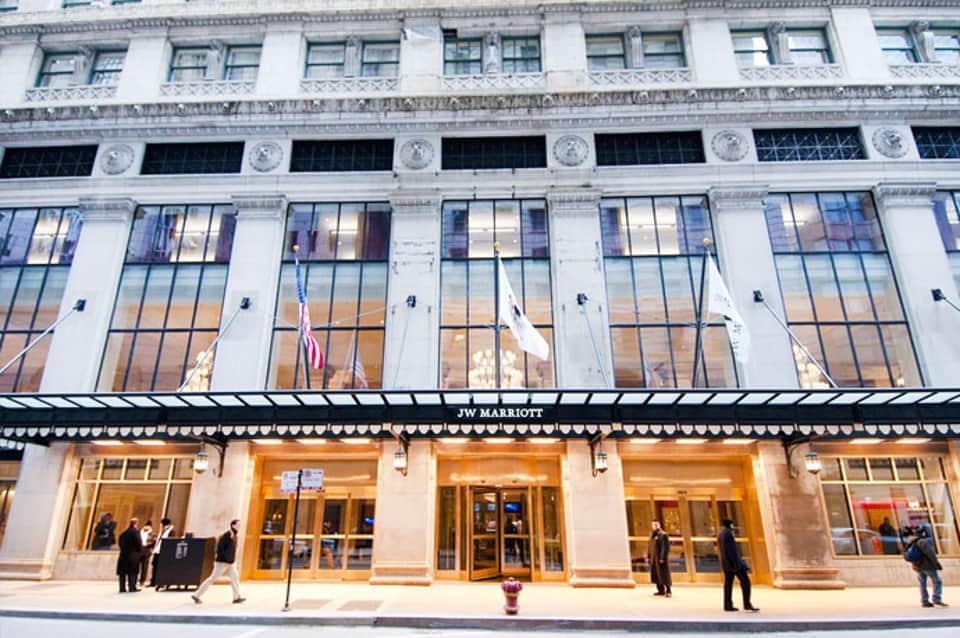 JW Marriott storefront with classical architecture and large windows on Fifth Avenue