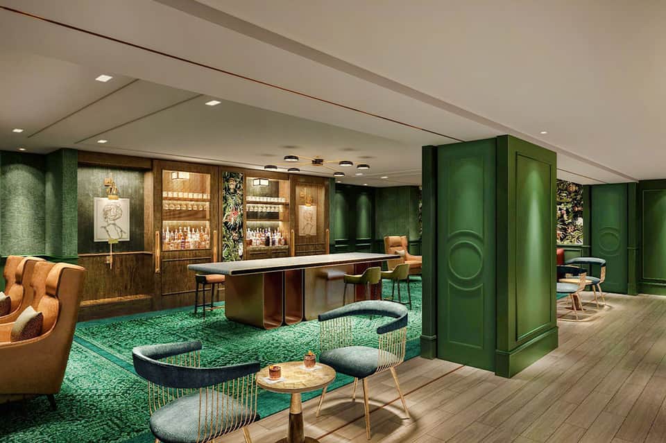 Upscale lounge interior with green walls, bar, and mid-century modern furnishings
