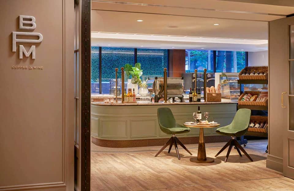 BM Coffee & Wine café interior with counter seating, ocean views, and artisan bakery display