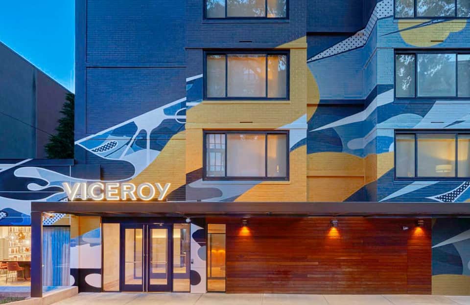 Modern building exterior with blue and gold fish mural and Viceroy signage