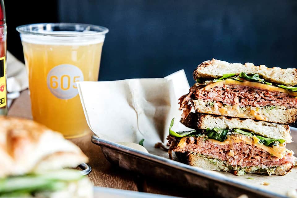 Gourmet sandwich and craft beer at resort dining venue