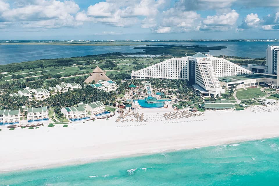 All-inclusive beachfront resort with white sand beach, pools, and lagoon views