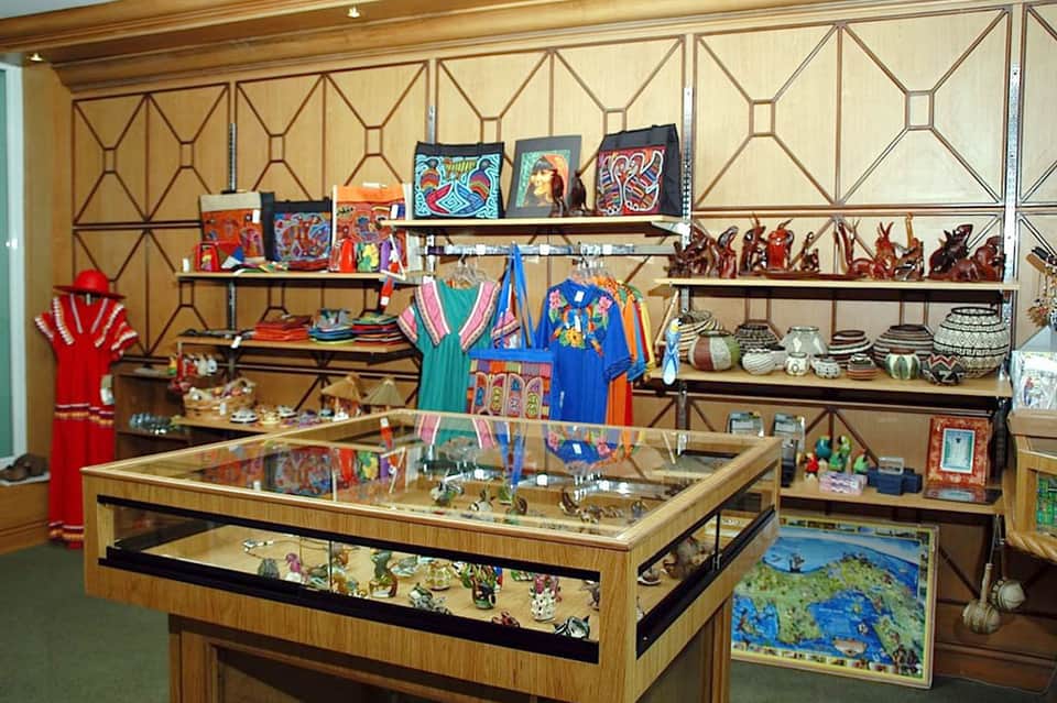 Retail shop display with traditional folk art, crafts, and colorful cultural artifacts