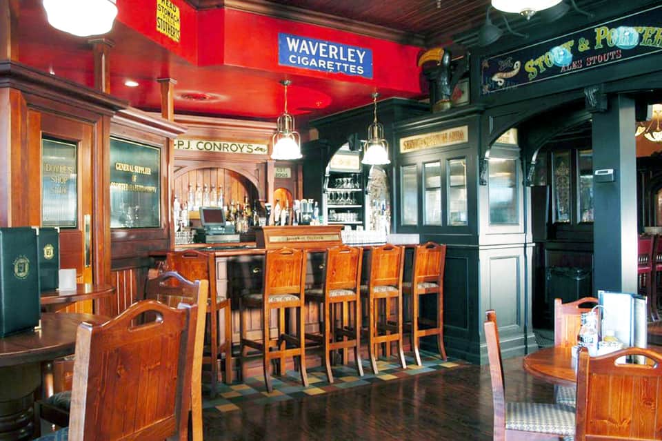 Historic wooden bar interior with Waverley Cigarettes sign and P.J. Conroy's establishment