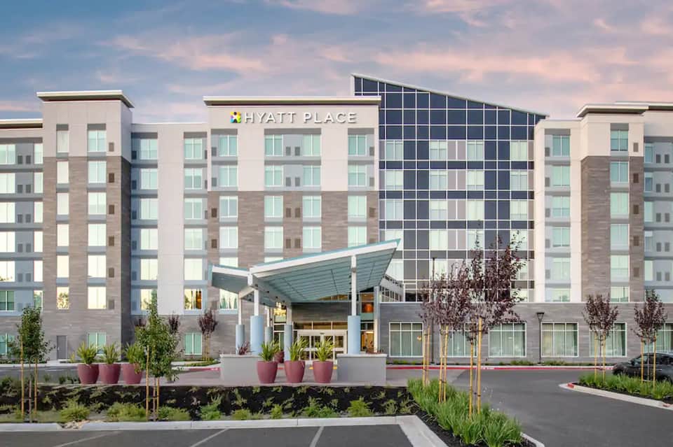 Modern Hyatt Place hotel exterior with contemporary architecture and manicured landscaping
