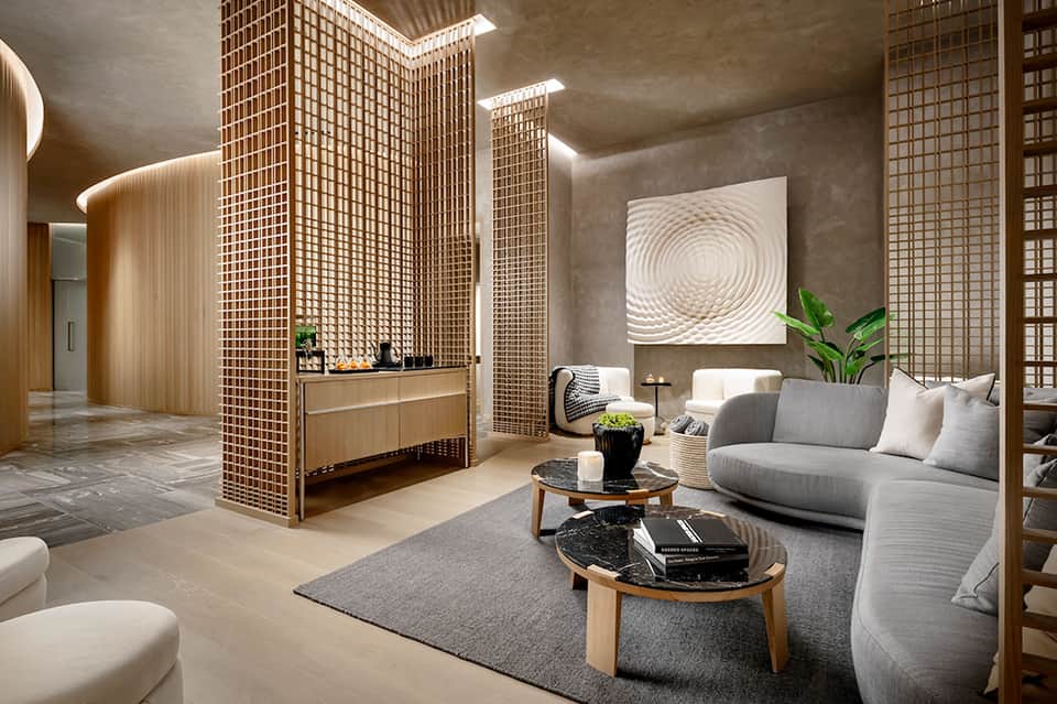 Luxury spa reception area with wooden lattice screens, neutral tones, and contemporary minimalist design
