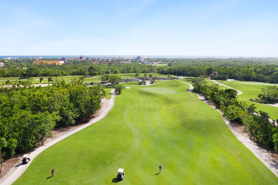 Aerial view of championship golf course with fairways and trees