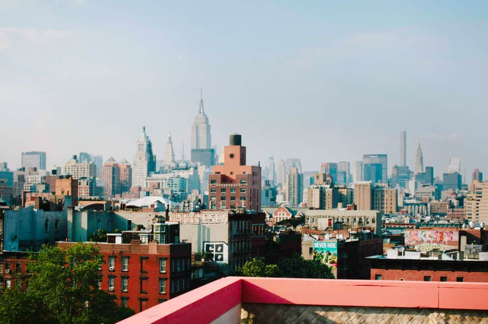 Manhattan skyline view from rooftop with Empire State Building and diverse architecture
