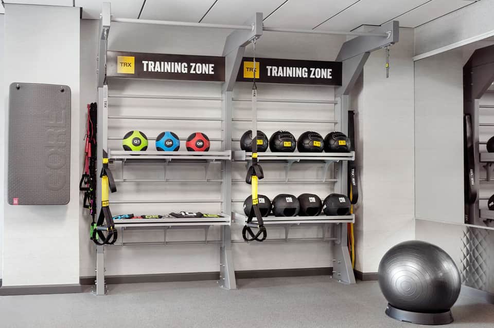 Fitness training zone with colorful medicine balls and suspension equipment