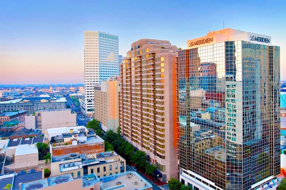 Urban hotel skyline at dusk with Le Méridien building and surrounding downtown cityscape