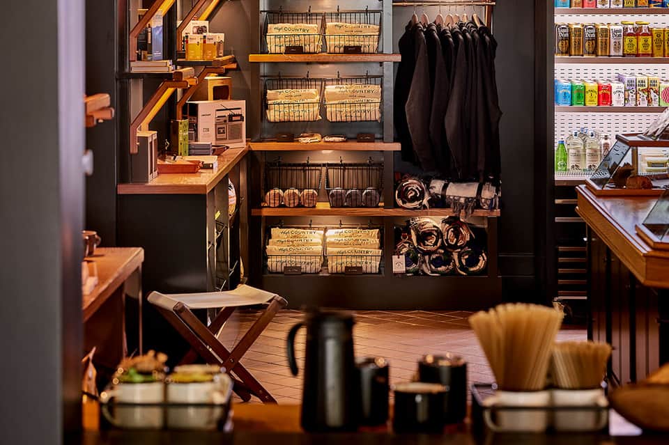 Retail shop interior with shelving, merchandise displays, and product stands