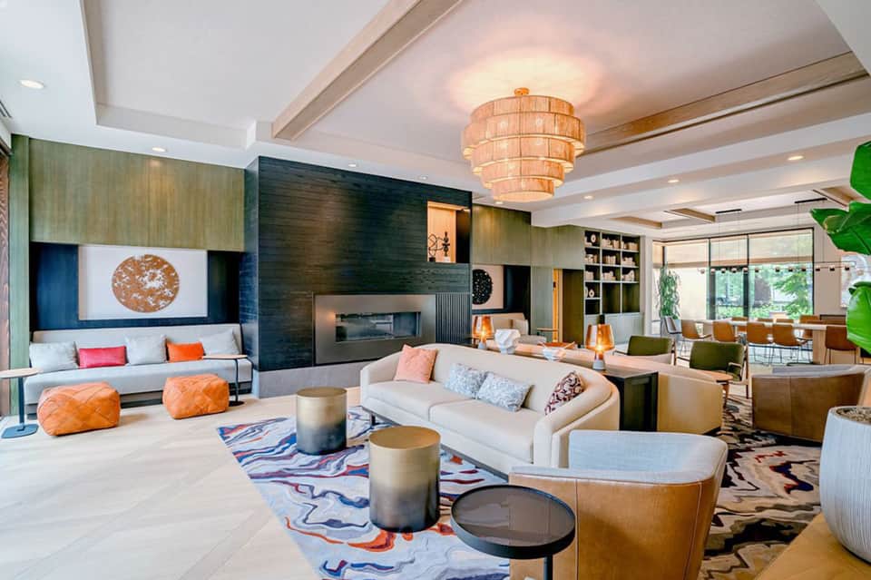 Sophisticated hotel lobby lounge with fireplace, modern seating, and decorative lighting