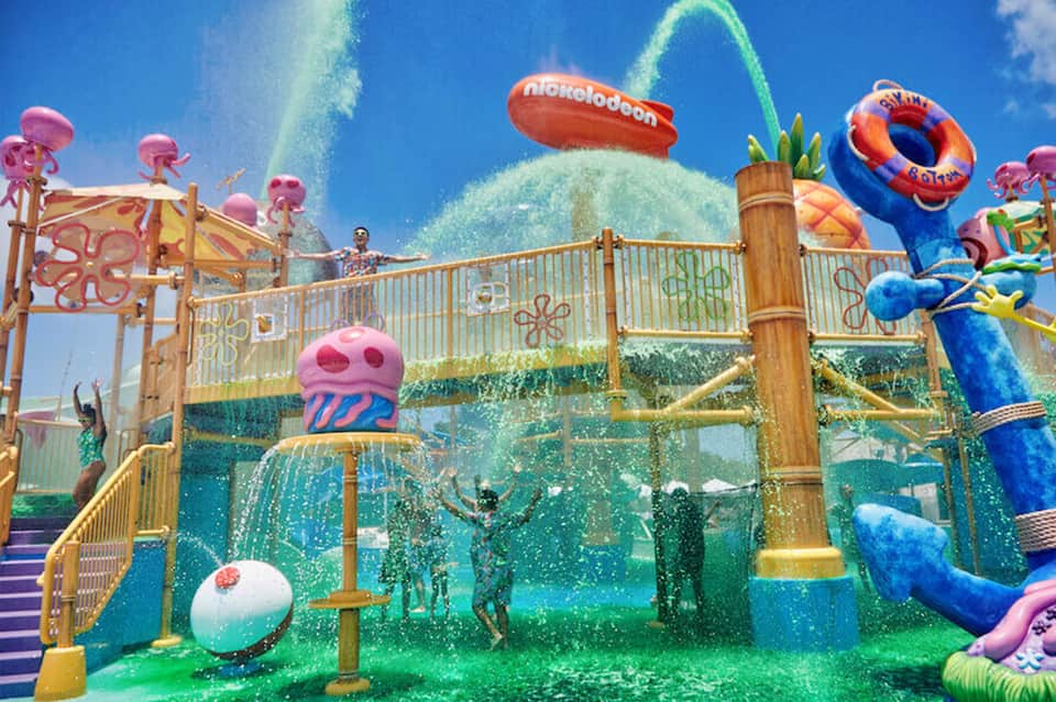 Nickelodeon water park feature with colorful splash zone and decorative playground structures