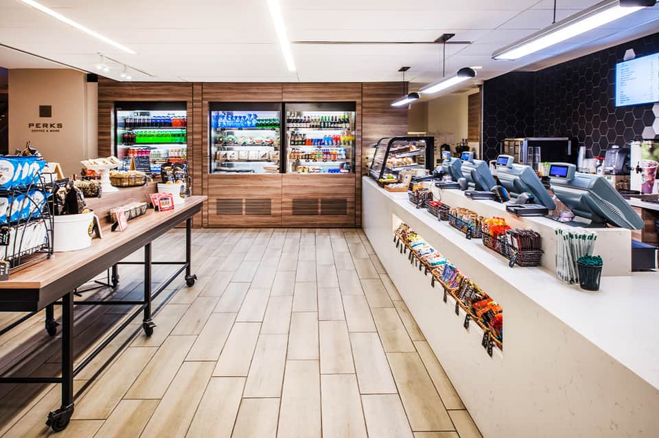 Modern resort cafe and convenience store with wooden design and refrigerated beverage cases