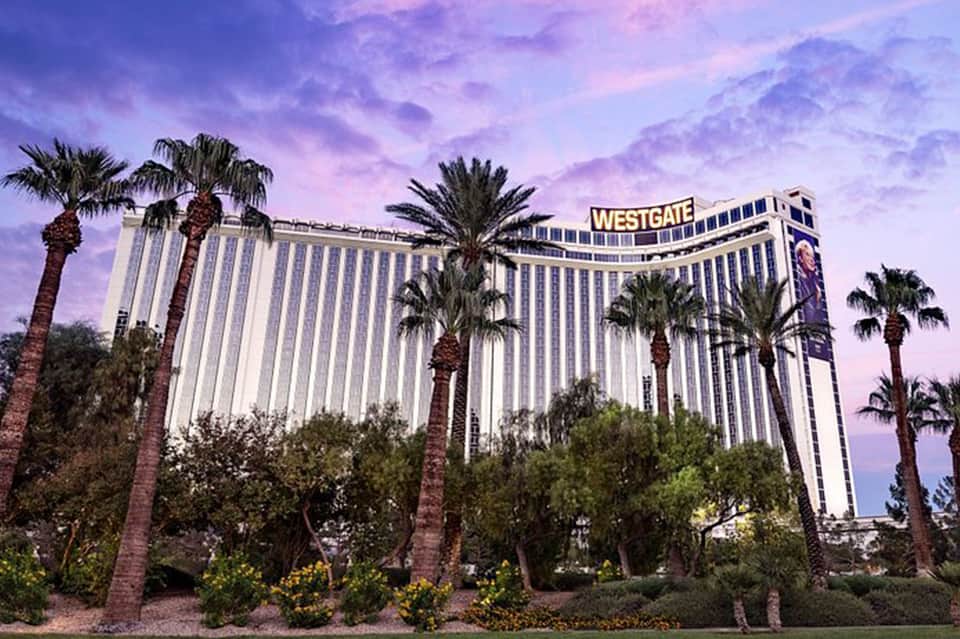 Westgate hotel exterior at dusk with palm trees and purple sky