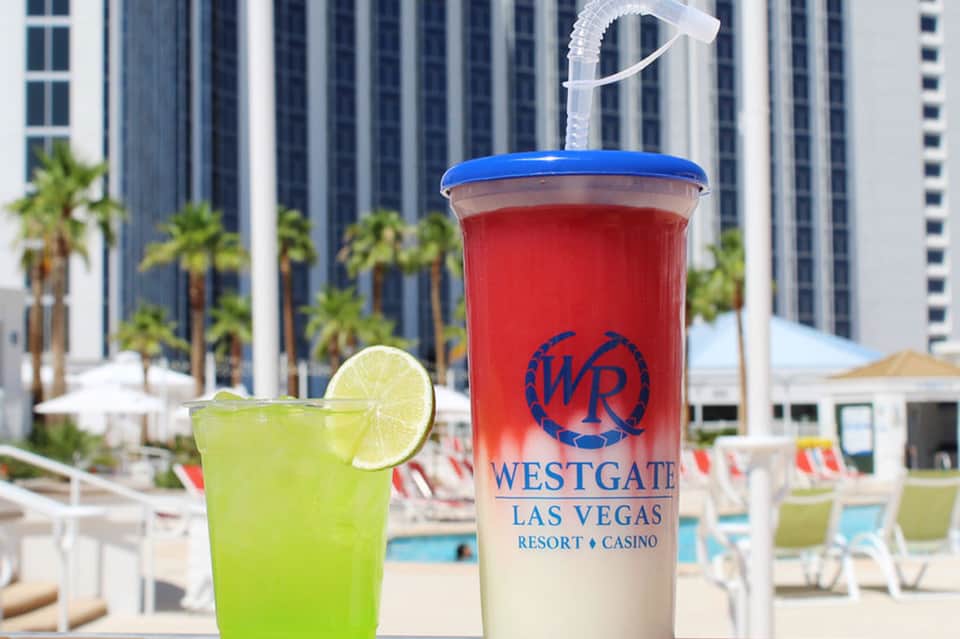 Poolside drink with lime garnish at Westgate Las Vegas Resort Casino with city towers
