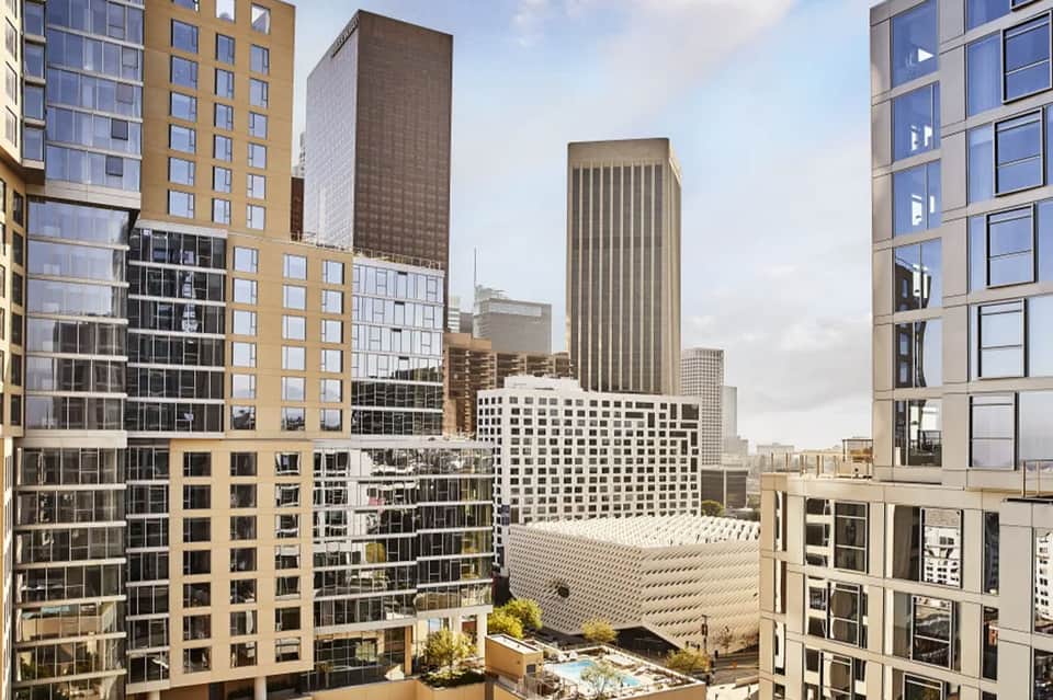 Downtown city skyline view showing mixed residential and office towers with modern architecture