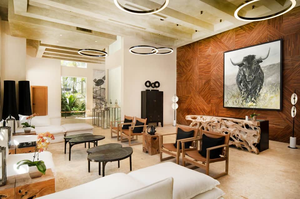 Luxury resort lobby with modern lighting, wood accents, and contemporary furniture