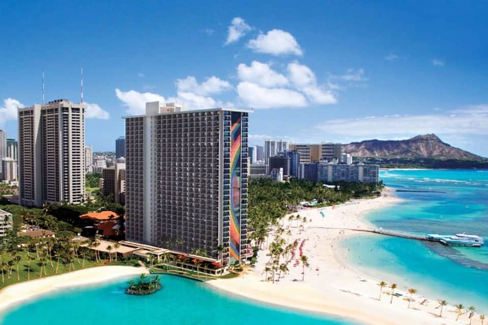 High-rise beachfront resort towers with private lagoon pool overlooking Waikiki Beach and Diamond Head