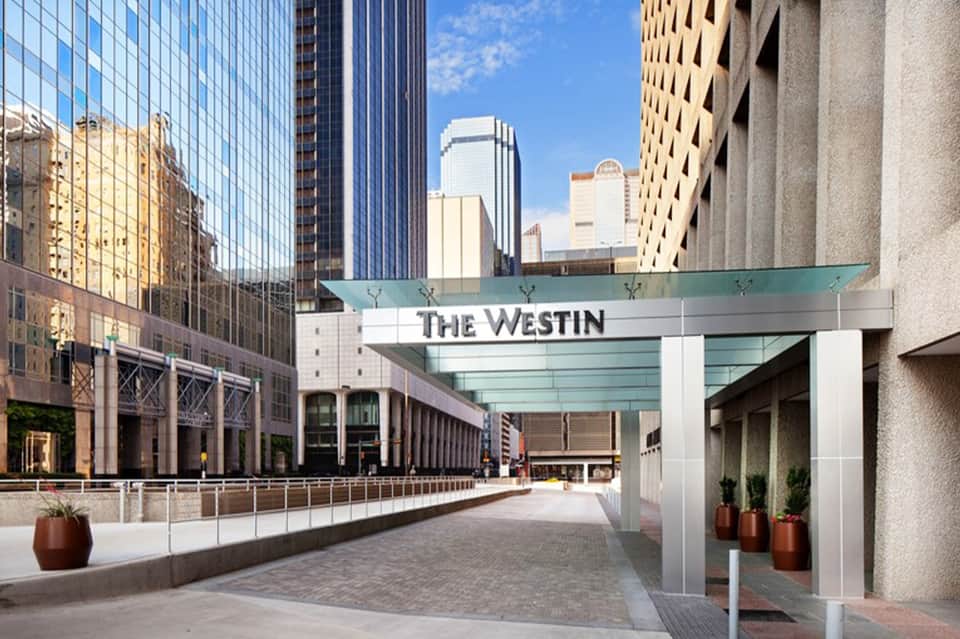 The Westin hotel entrance with glass canopy in downtown urban setting