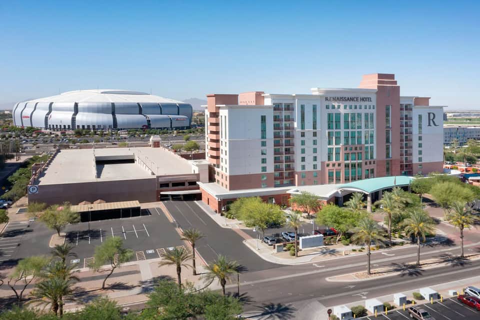 Modern hotel complex with Renaissance hotel and adjacent sports arena in desert landscape