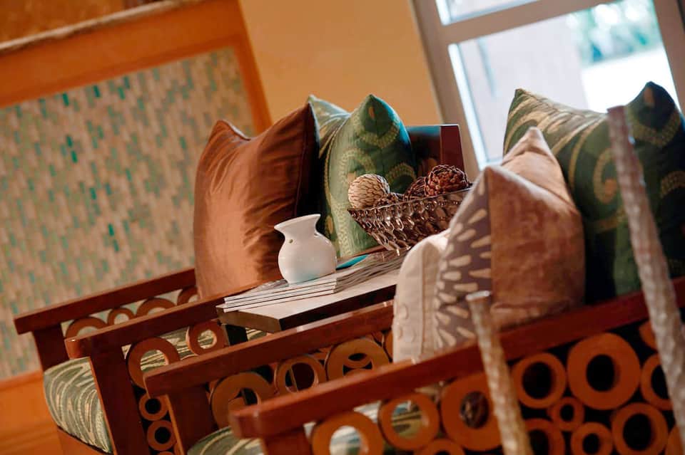 Decorative pillows and room details with warm earth tones and patterned fabrics