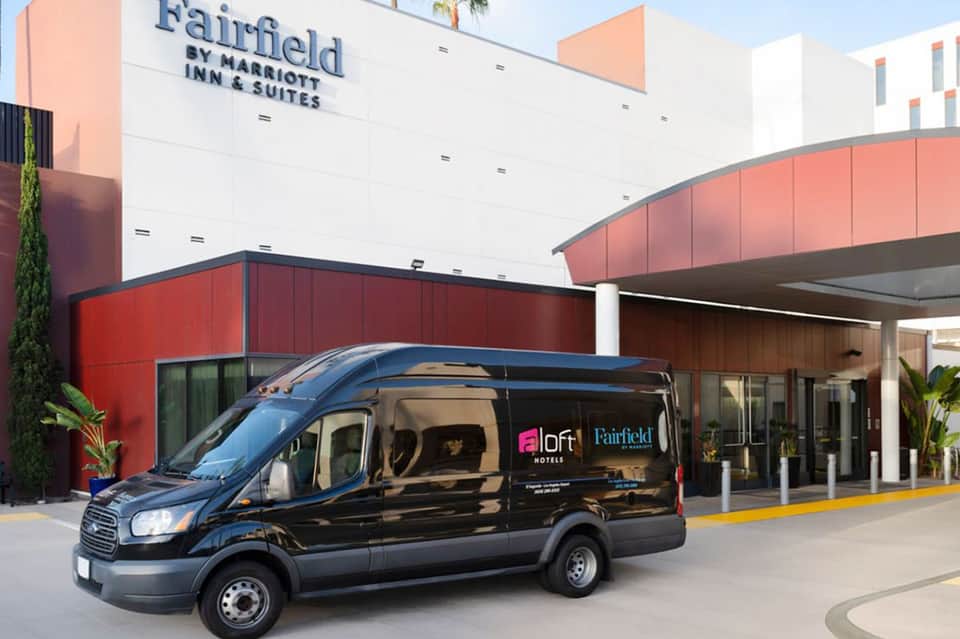 Black shuttle van parked at Fairfield by Marriott Inn & Suites entrance