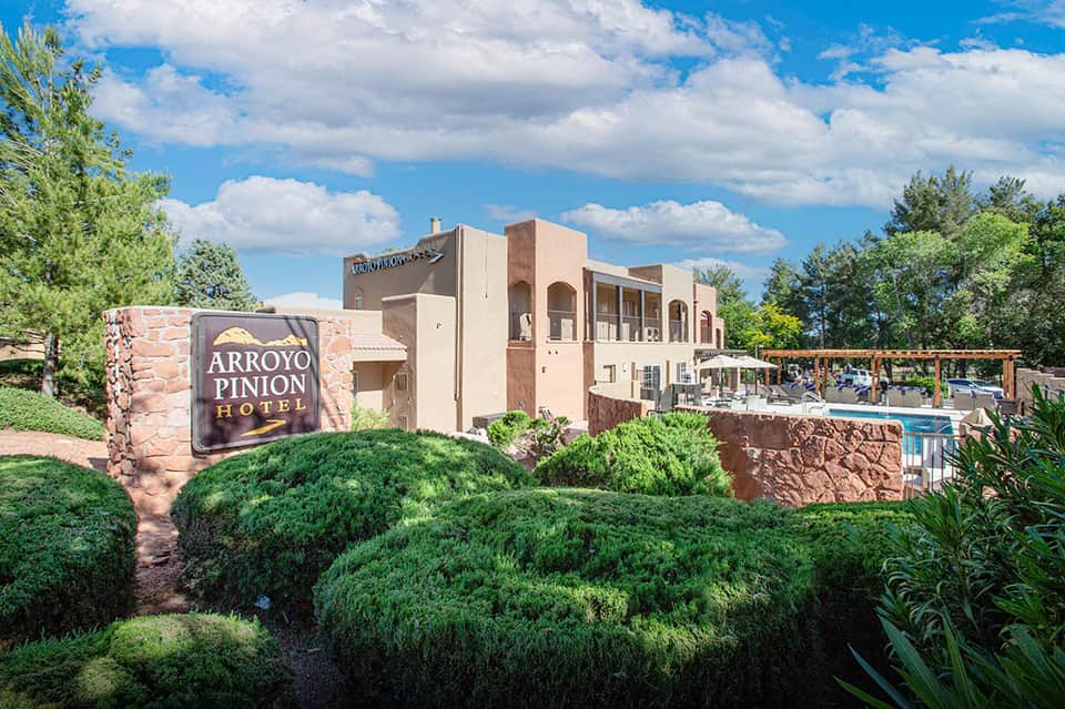 Arroyo Pinion Hotel exterior with Southwestern architecture and pool area