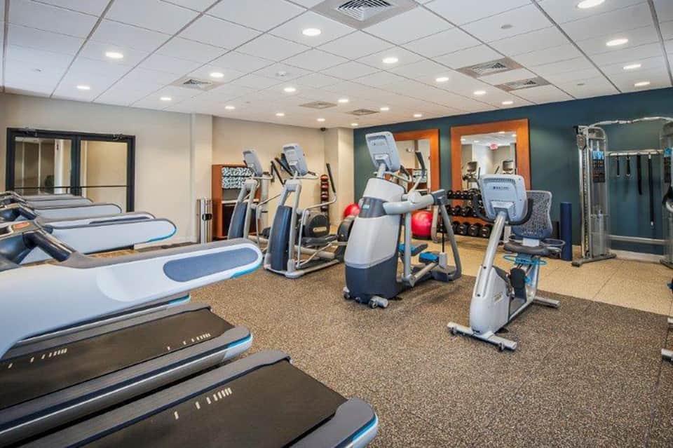Well-equipped fitness center with cardio machines and strength training equipment