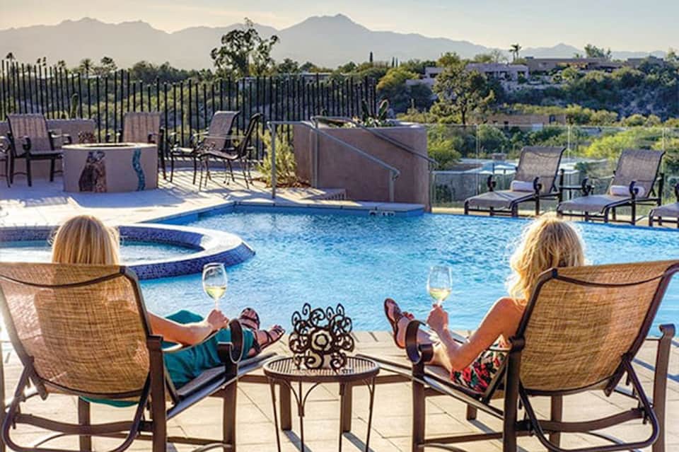 Luxury poolside seating with mountain views and resort amenities