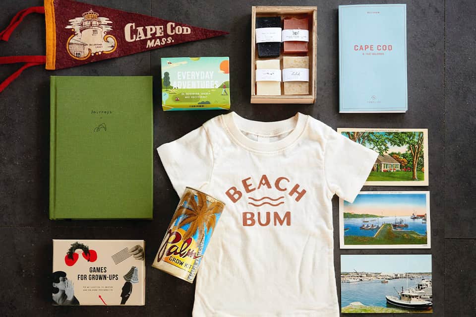 Cape Cod themed gift collection with beach t-shirt, books, postcards, and vintage pennant