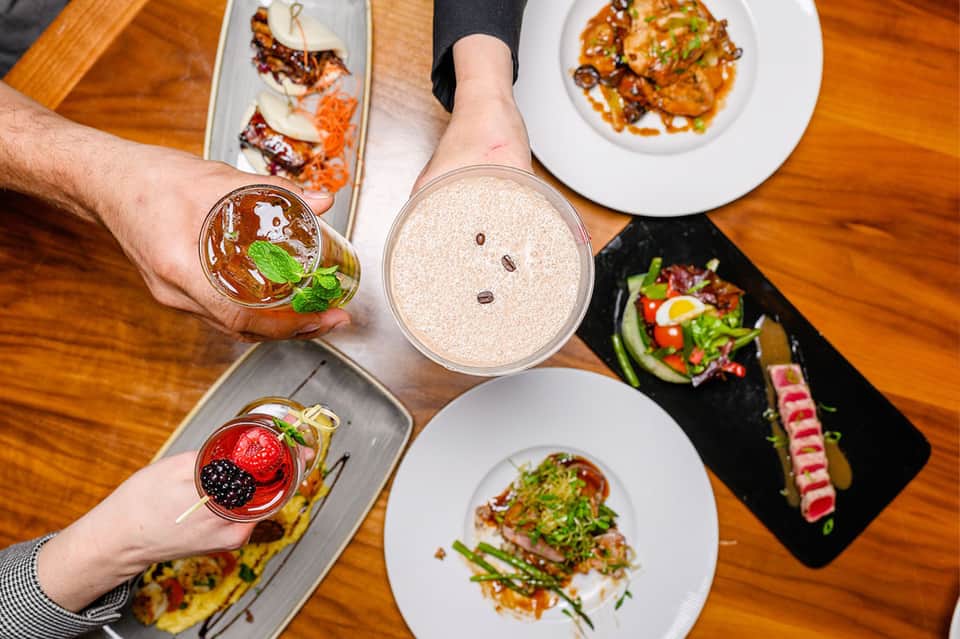 Fine dining table with plated dishes and beverages at an upscale restaurant