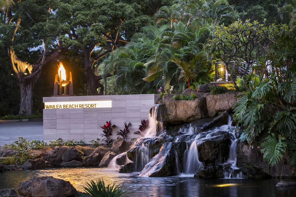 Wailea Beach Resort sign with waterfall and tropical landscaping